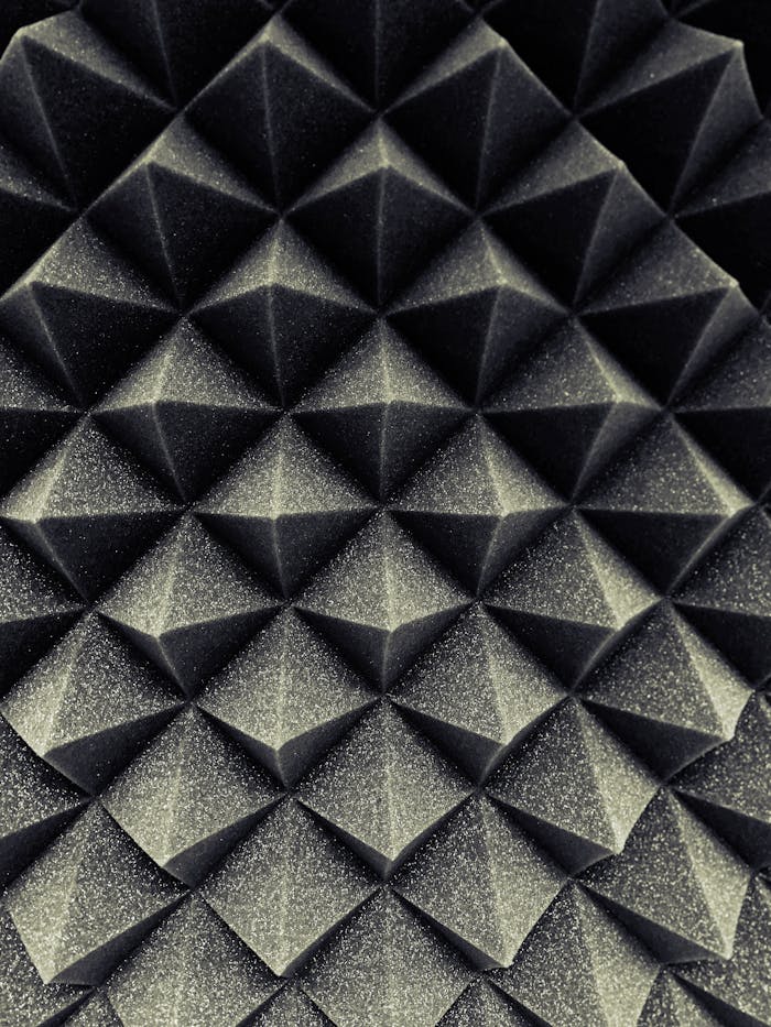 gallery-1 Close-up of a textured geometric pattern creating a three-dimensional visual effect.